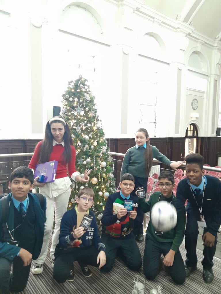 Students in front of a Christmas Tree 